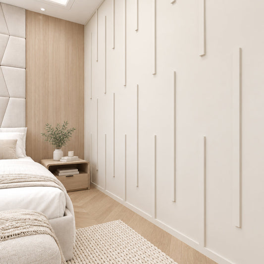 Living room wall molding with flat frames sized behind a sofa