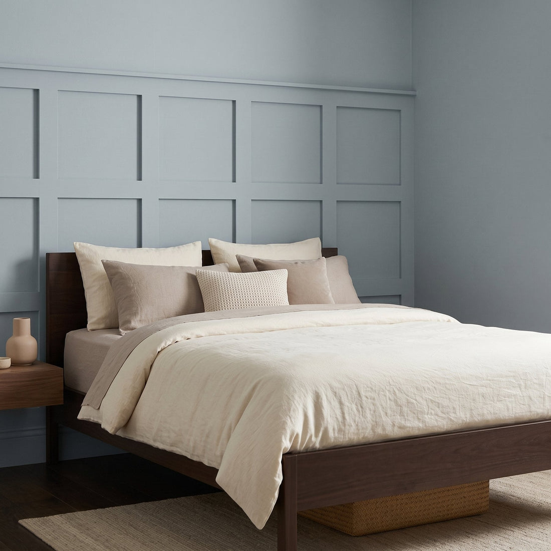MDF wall panels: light blue grid wall paneling behind a bed