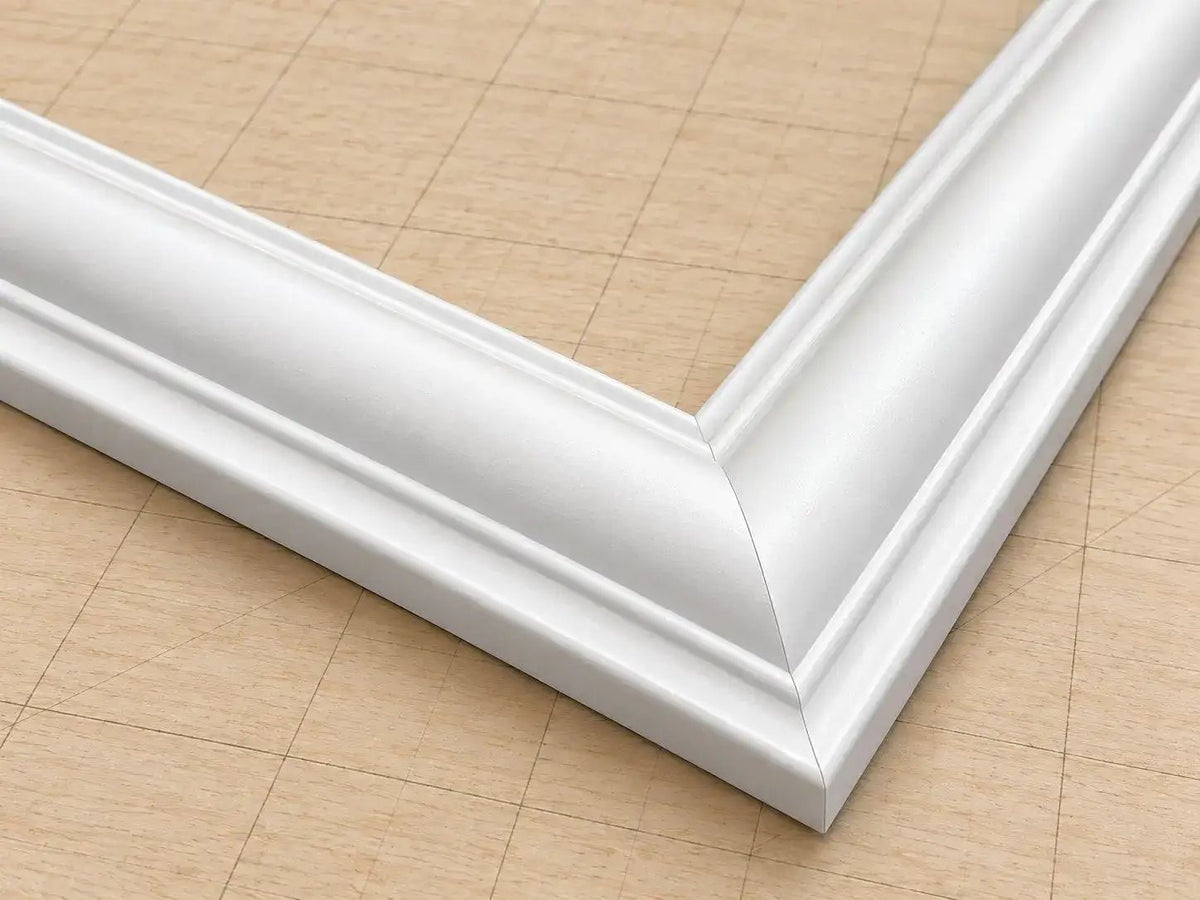 Mitered white molding corner joint, close-up