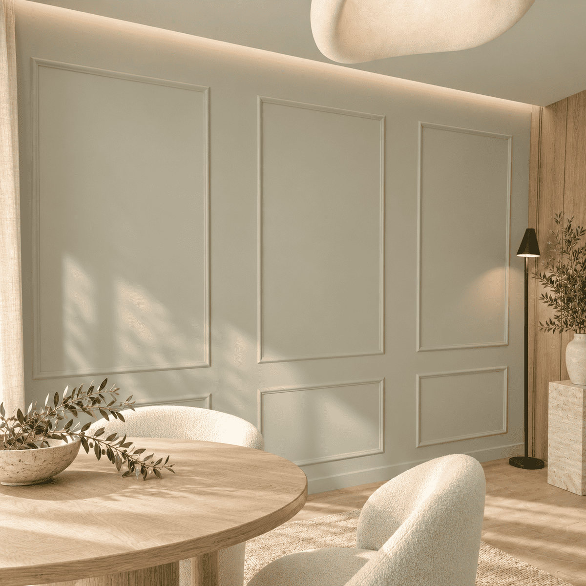 Pale sage picture frame wall molding in a dining room