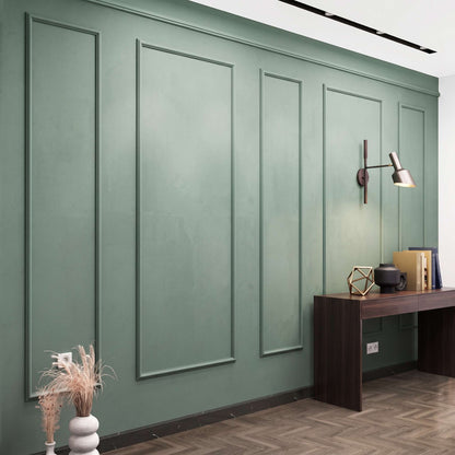 Sage green picture frame wall molding in a home office