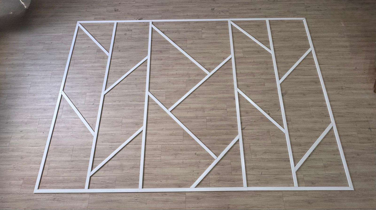 Pre-cut Asymmetric Wall Molding Kit pieces laid out before installation