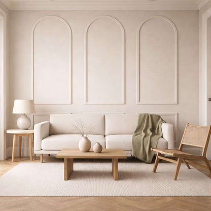 Beige arched wall molding in a living room, wide view