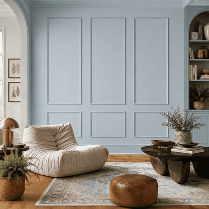 Light blue picture frame wall molding in a living room