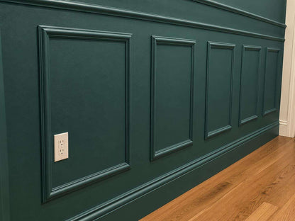 Half wall trim idea: forest green half wall picture frame wainscoting on an accent wall