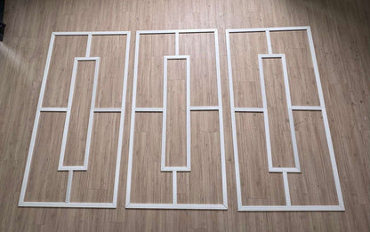Pre-cut Modern Wainscoting Kit pieces laid out before installation
