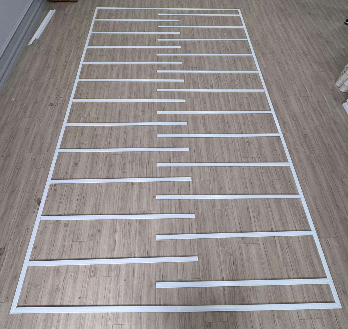 Modern Wall Trim pieces laid out on the floor, second view