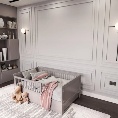 Light gray picture frame wall molding in a nursery