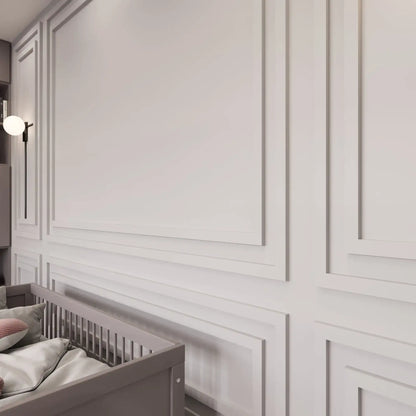 Light gray picture frame wall molding in a nursery, wide view