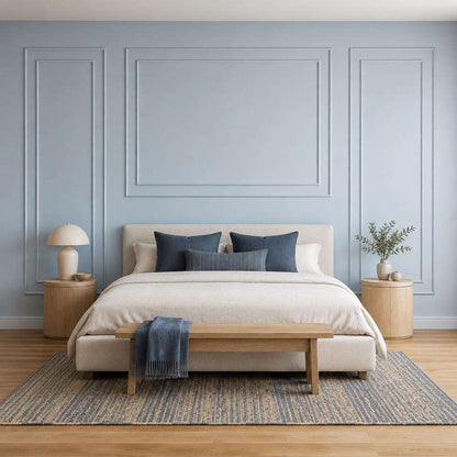 Bedroom wall molding design: light blue picture frame wall molding behind the bed