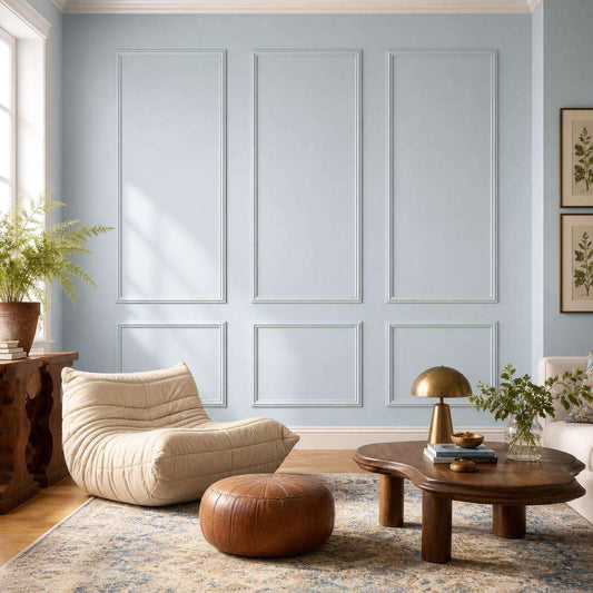 Light blue picture frame wall molding in a living room alternate view