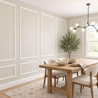 White picture frame wall molding in a dining room