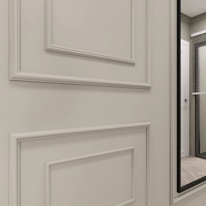 Close-up of a mitered picture frame molding corner on a wall