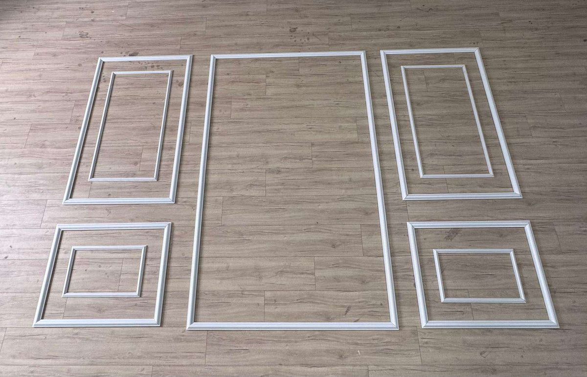 Pre-cut Shadow Box Molding Kit pieces laid out before installation